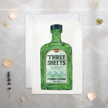 Load image into Gallery viewer, Card with a green liquor bottle illustration labeled 'Three Sheets' on a textured surface.