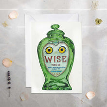 Load image into Gallery viewer, Green bottle with owl design and 'WISE Tonic' text on a textured surface.